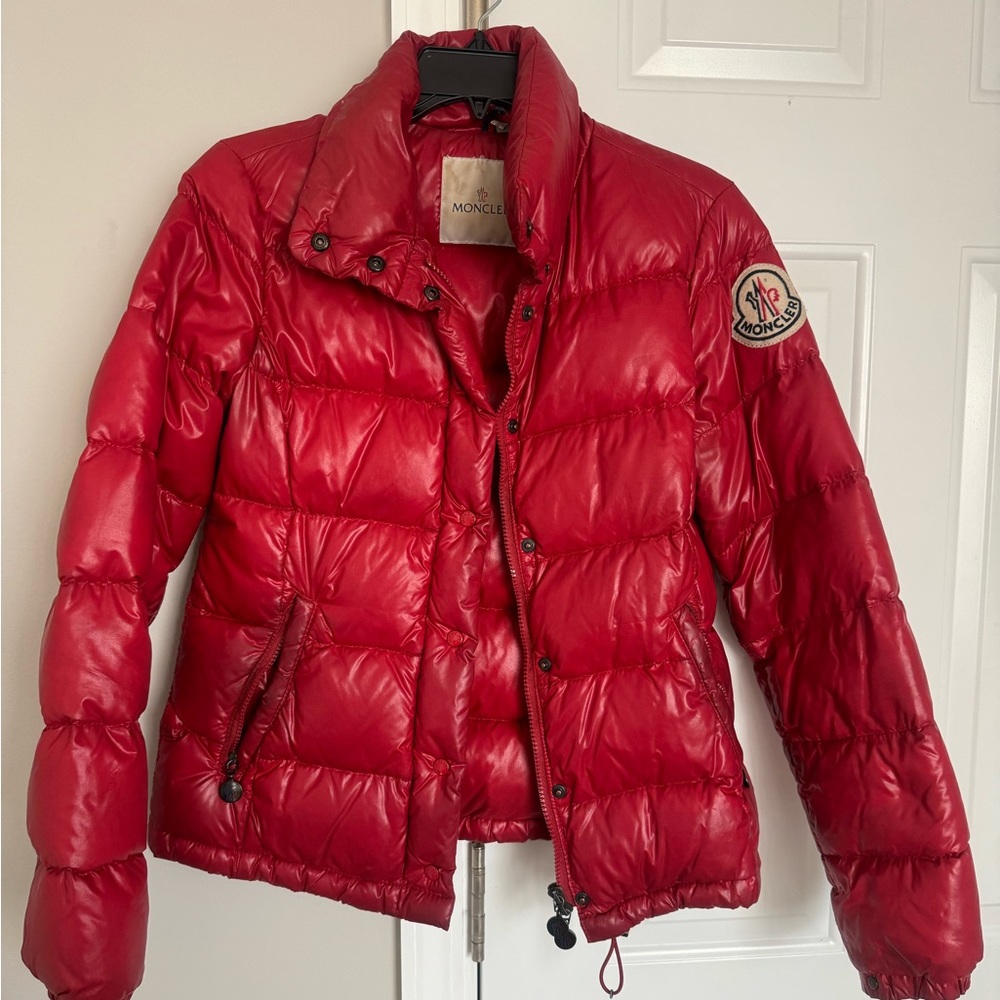 Moncler Coat size small color red with logo on sleeve. Worn often.